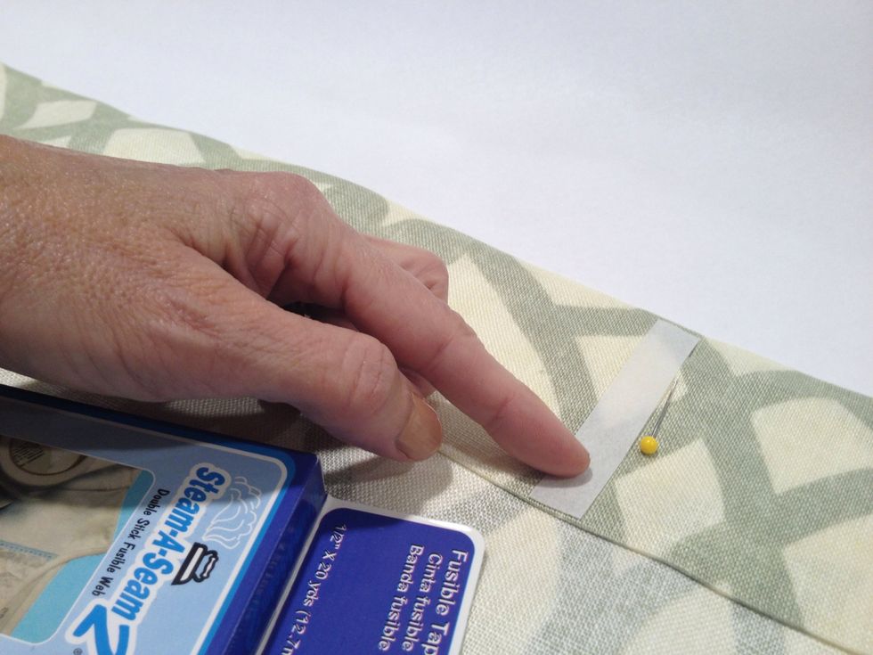 Apply small piece of Steam-a-Seam to the back side of the header where you marked earlier.