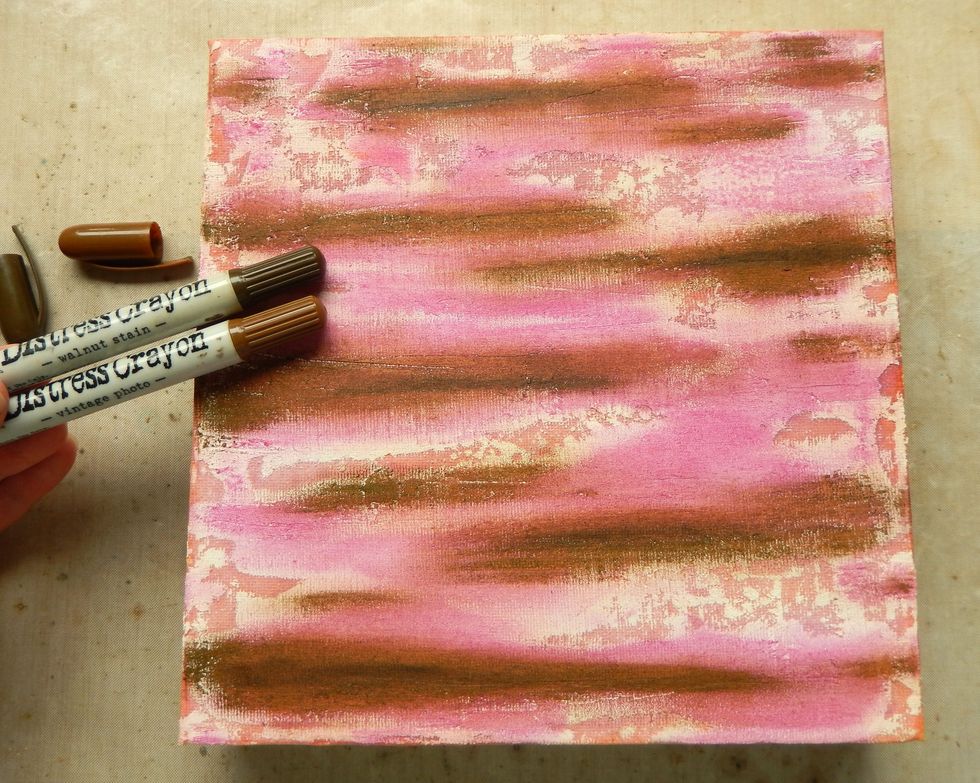 Apply smaller amounts of Vintage Photo and Walnut Stain Distress Crayons over the top of the previously coloured areas and blend out with your finger.