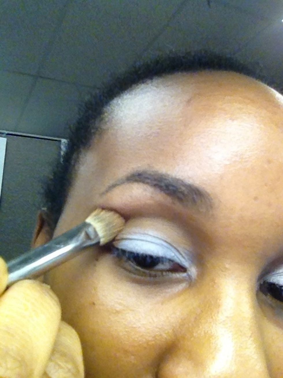 Apply 'Soft Brown' Eyeshadow to your crease