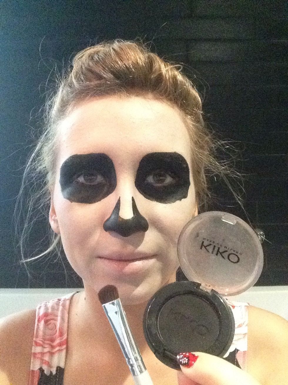 Apply some black eyeshadow to fix it and avoid shining