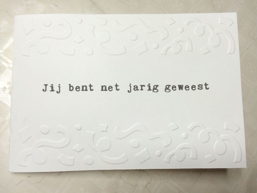 Apply some double-sided tape to the folded edge on the front of your card.