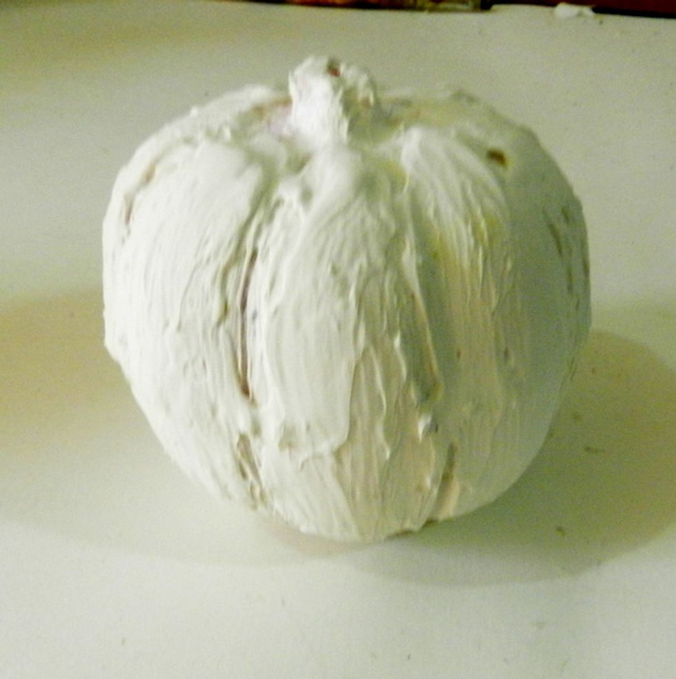 Apply some layers of Modeling Paste to create more texture on the pumpkin.