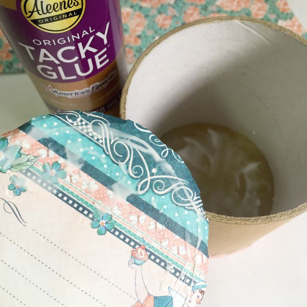 Apply some tacky glue onto the inside of the base, as well as the pattern paper.