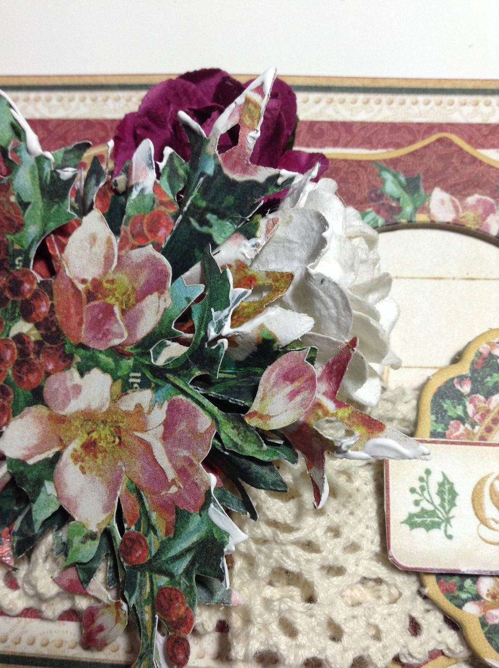 Apply some white gesso to the flowers and snowflake and..