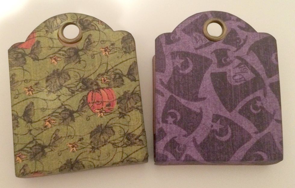 Apply Sookwang tape to the bottom of each ATC tag where the 1/2" flap is. Adhere the matching tags together. You'll do this for both tag sets.