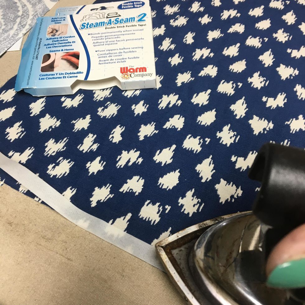 Apply SteamASeam2 around the entire edge of the wrong side of the basket back but do not remove the paper.