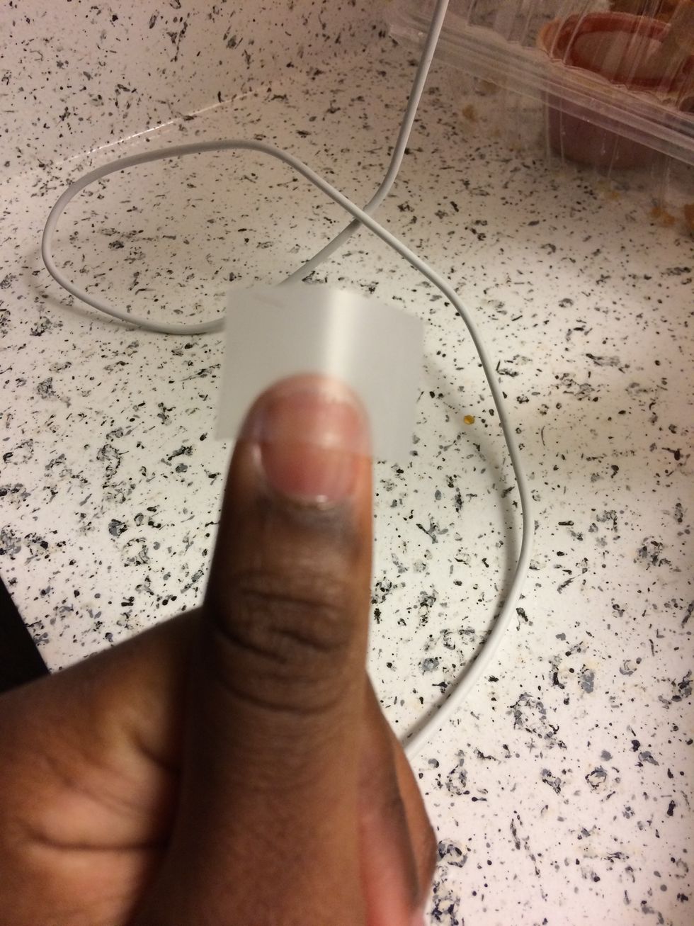 Apply tape to the upper half of your nail