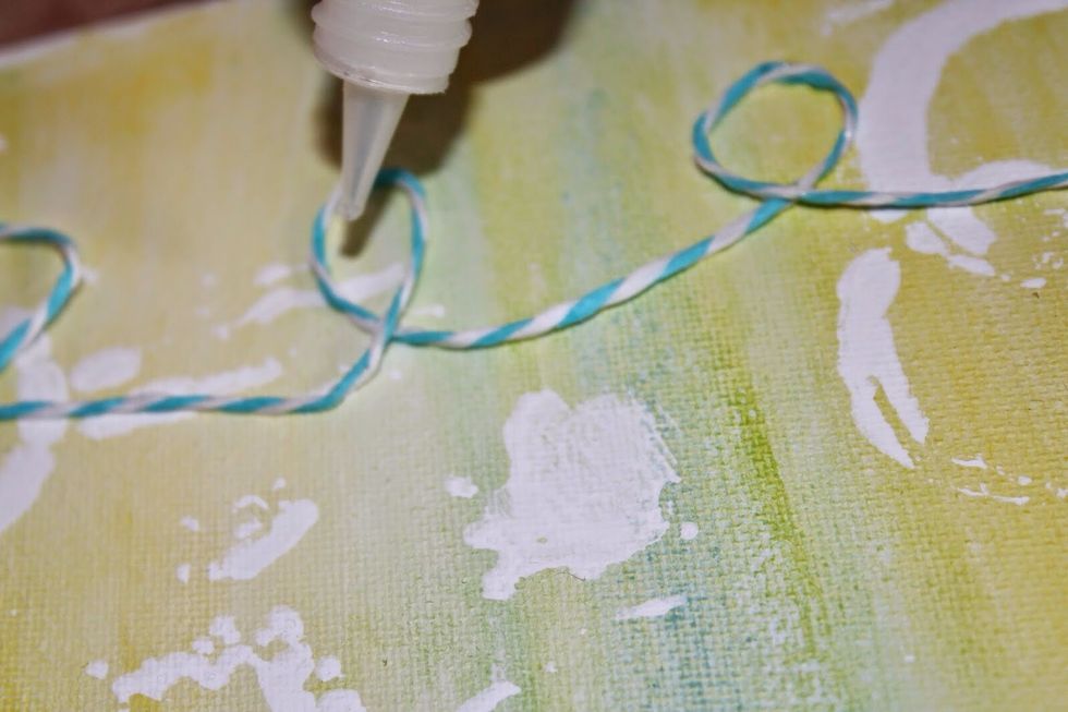 Apply Teresa Collins Clear Hold Adhesive to top and bottom points of twine.