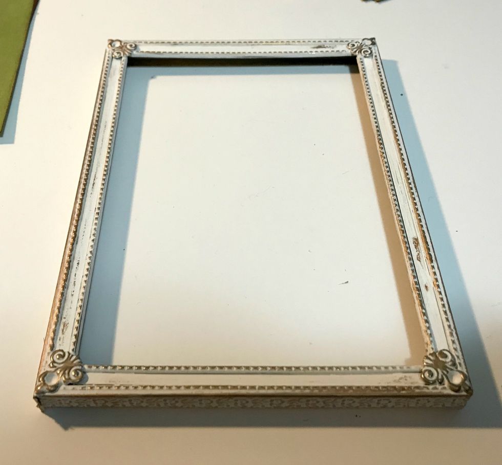 Apply the Aged Brass wax with your finger or brush onto your frame in desired spots you want to highlight on the frame.