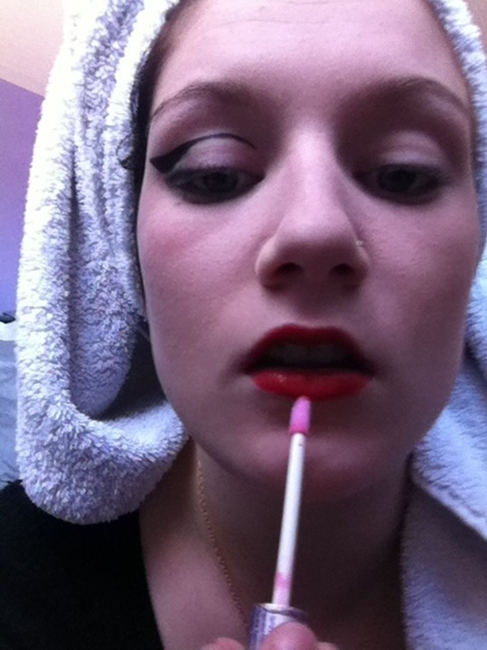 Apply the clear red lipgloss