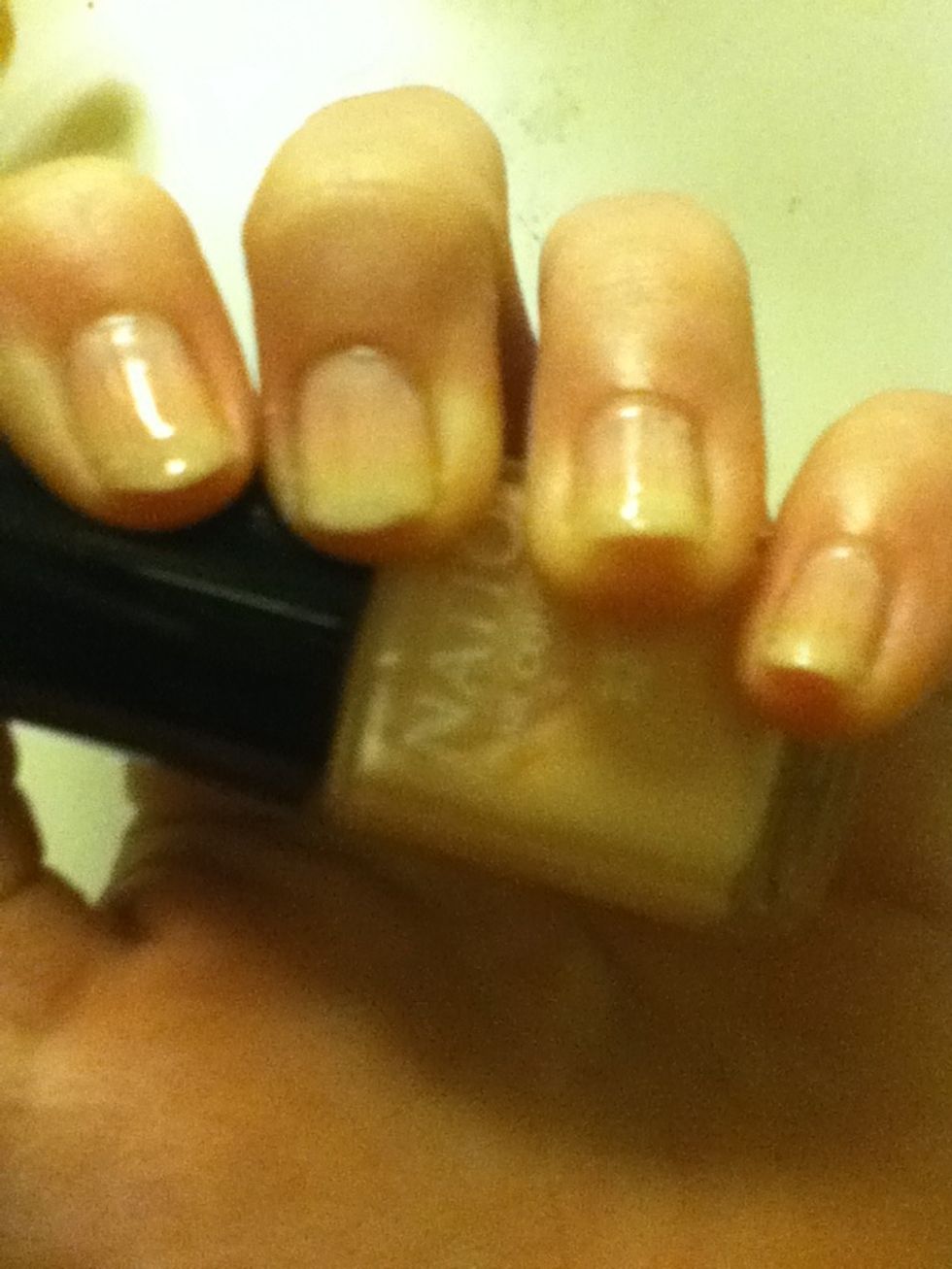 Apply the cream French manicure polish too both hands. Leave to dry.