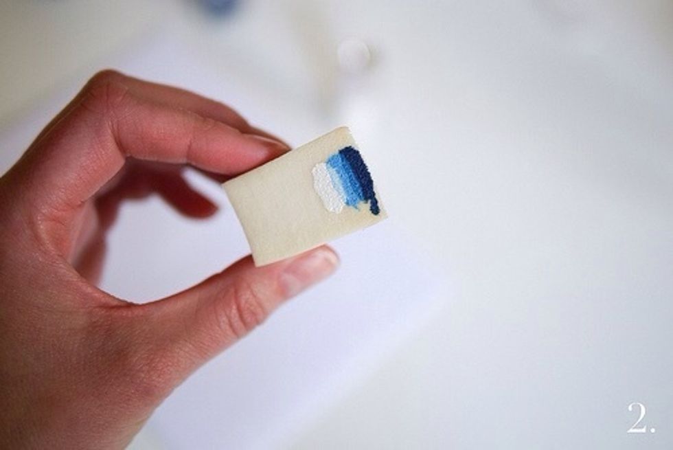 Apply the nail polish to the edge of the moist sponge. The darkest color closest to the edge. Continue with lighter and lighter colors. Put at least two layers polish on the sponge.