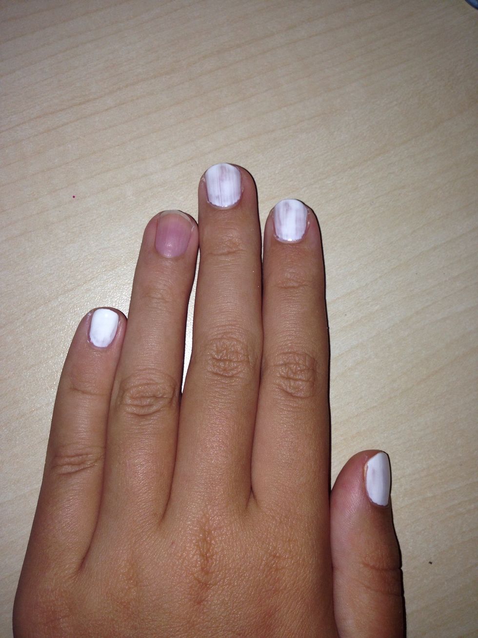 Apply the white nail polish to your nails except your ring finger