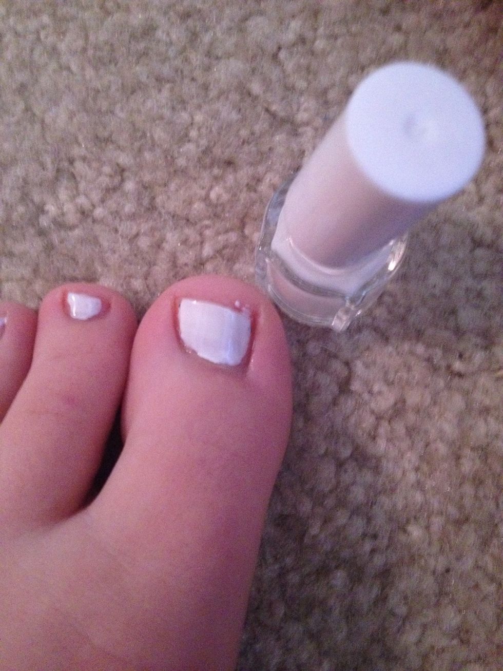 Apply the white polish and let it dry.
