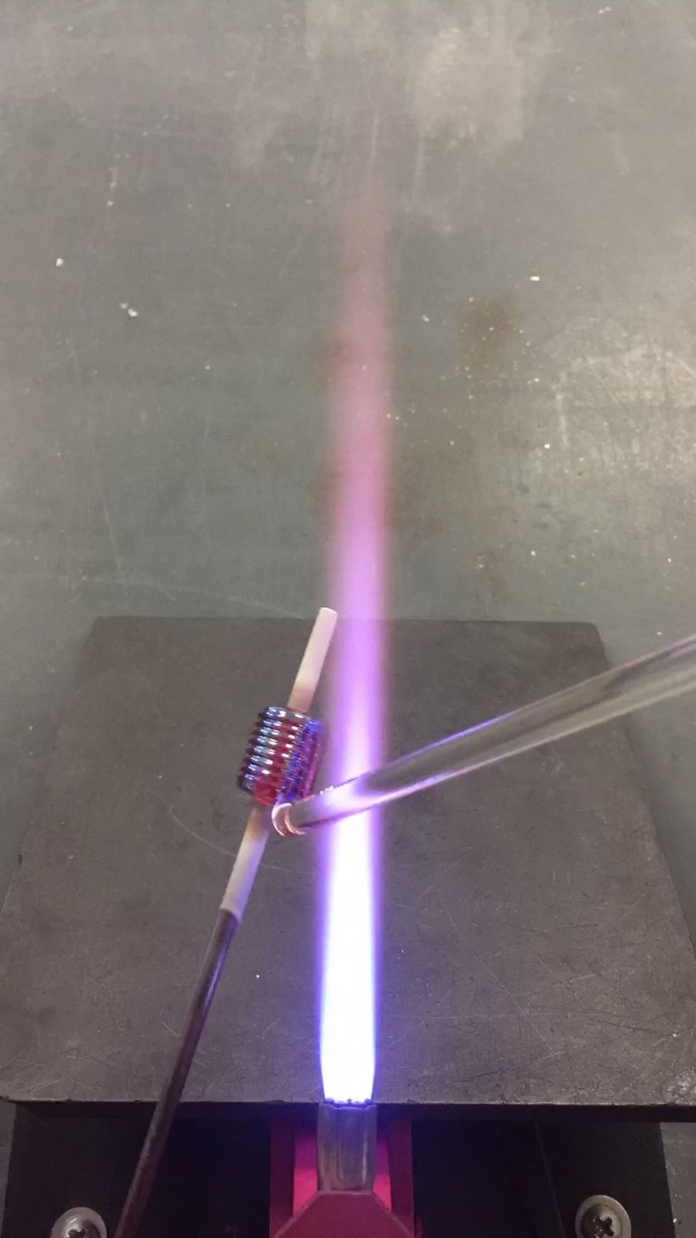 Apply the Zephyr in thin stripes,  heating just the tip of the rod.