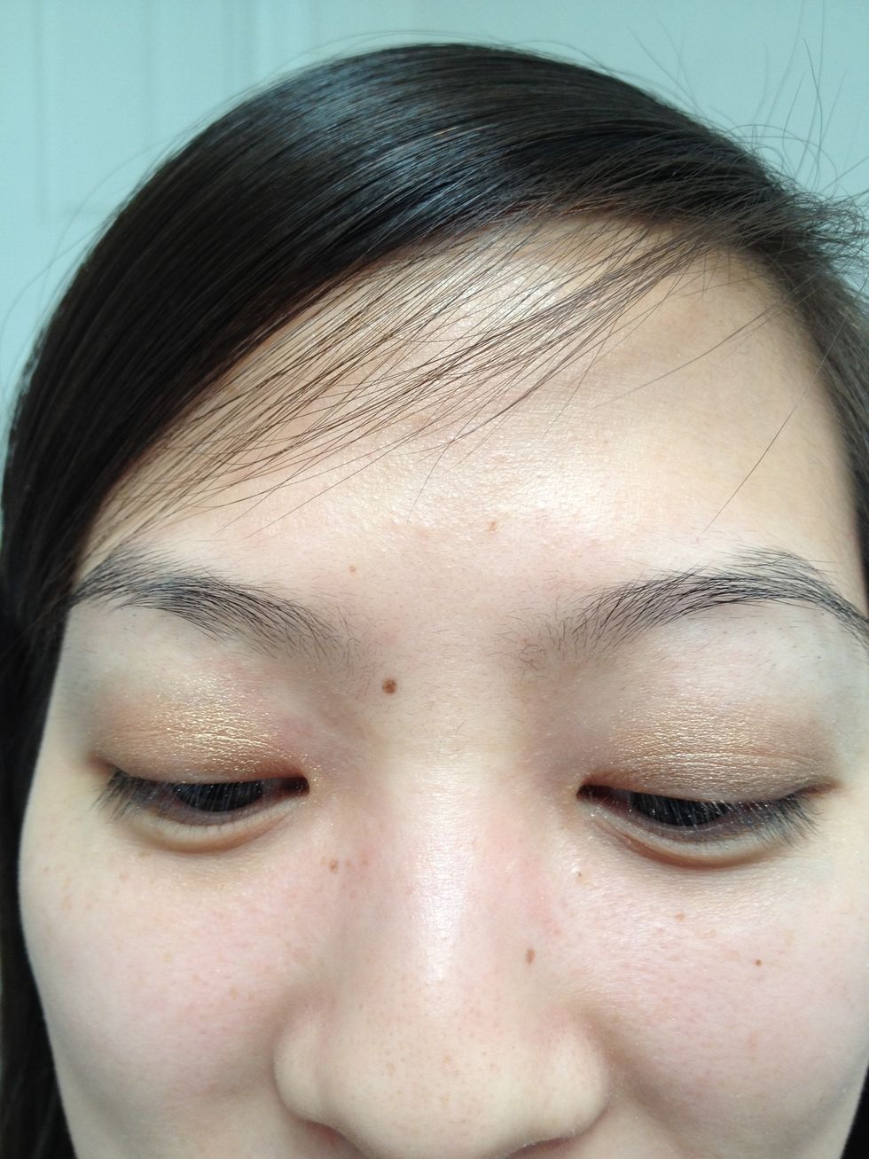 Apply this golden bronze color all over your lid.
