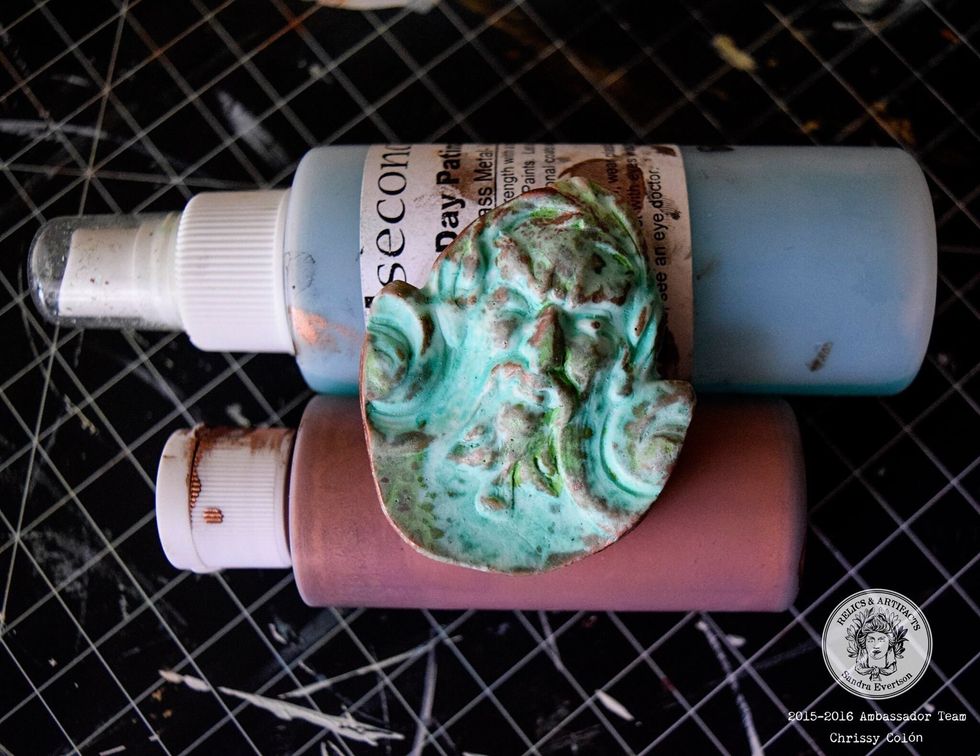 Apply VerDay copper paint and patina according to the directions. Set aside to dry . Once dry, use green mica powder and water to highlight the details on Poseidon\u2019s lovely mug