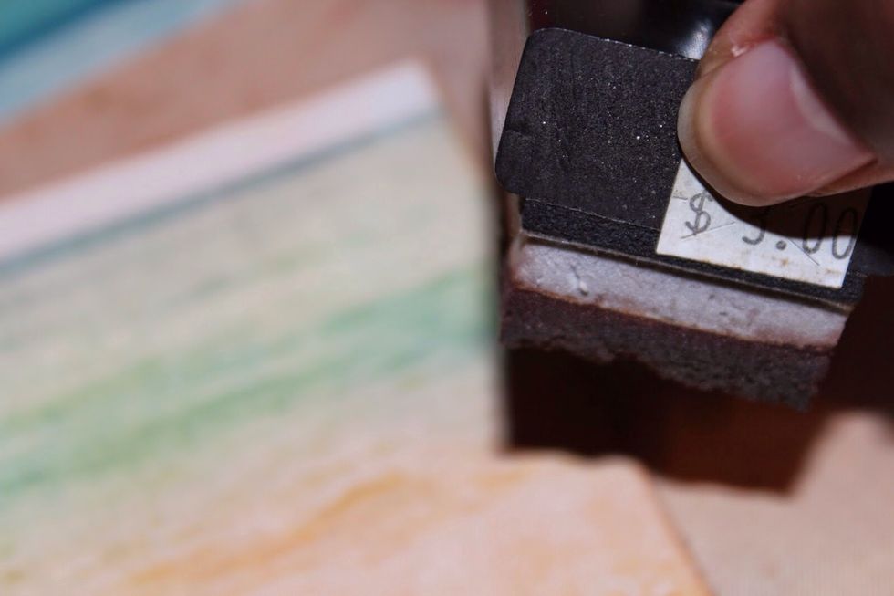 Apply vintage photo ink to patterned paper using foam tool.