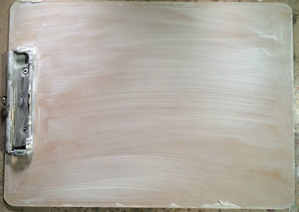 Apply white gesso generously to your clipboard...over the metal and everything...I let some overlap around the edges for some added texture...let this dry