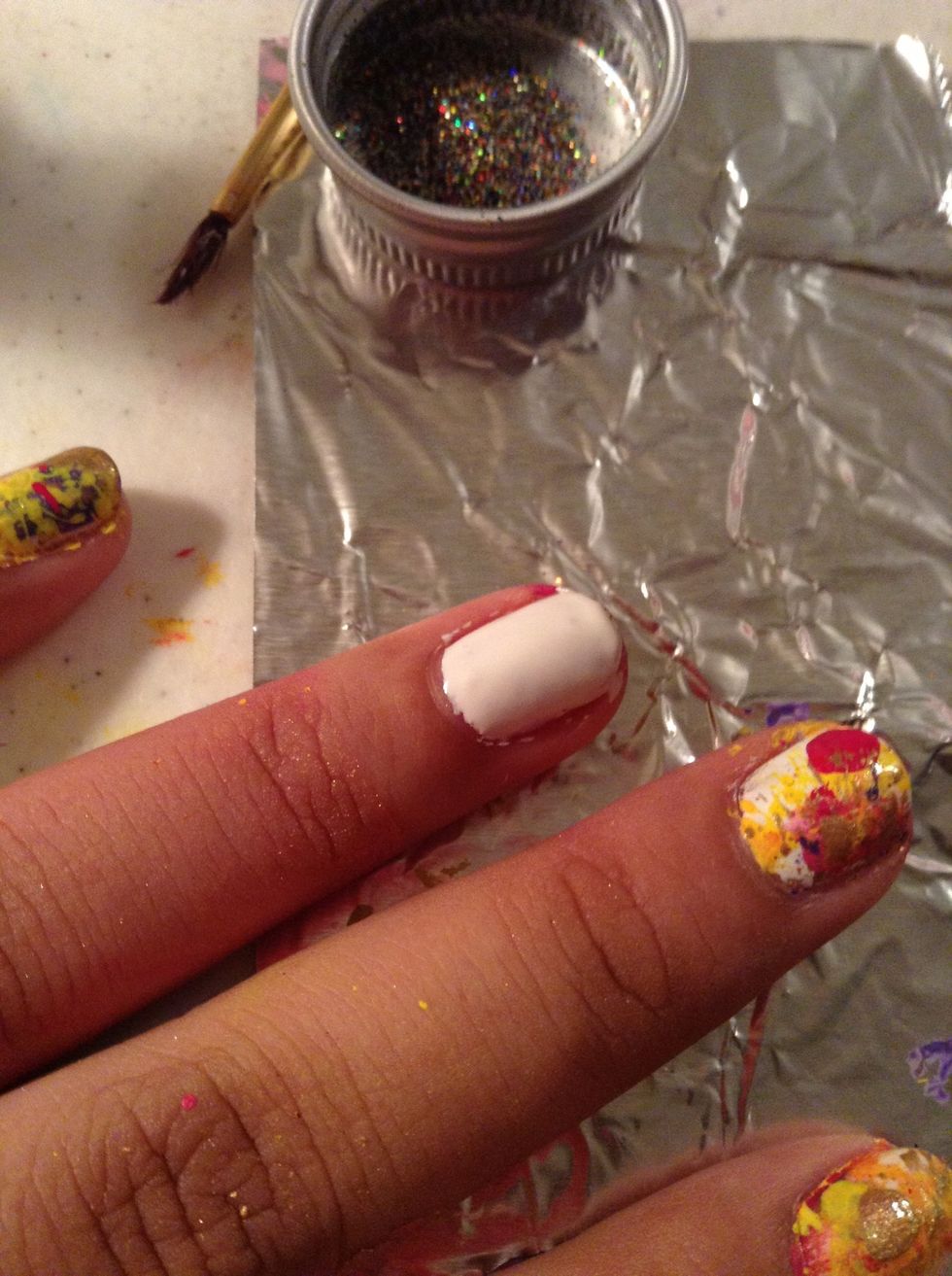 Apply your base color and as its still wet apply your glitter!