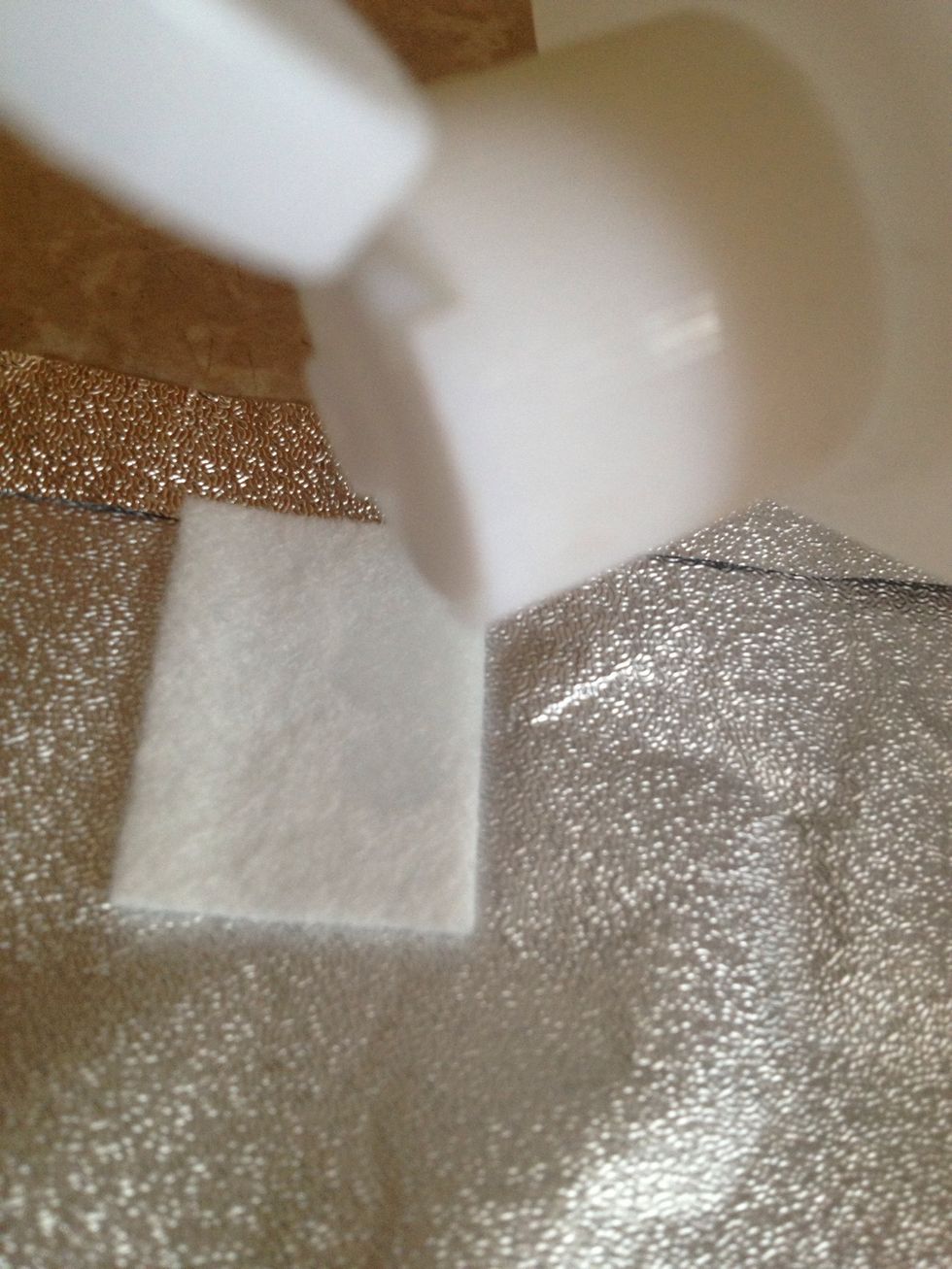 Applying the acetone to the cotton pad