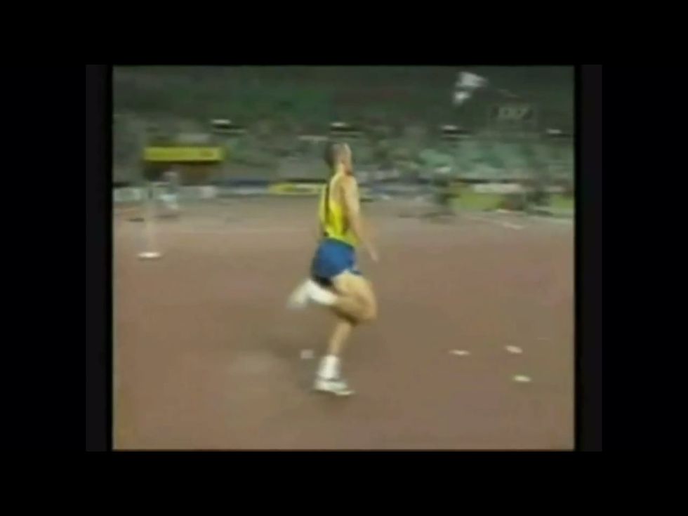 Approach the bar with a curved run up. It should be like a "J" shape.