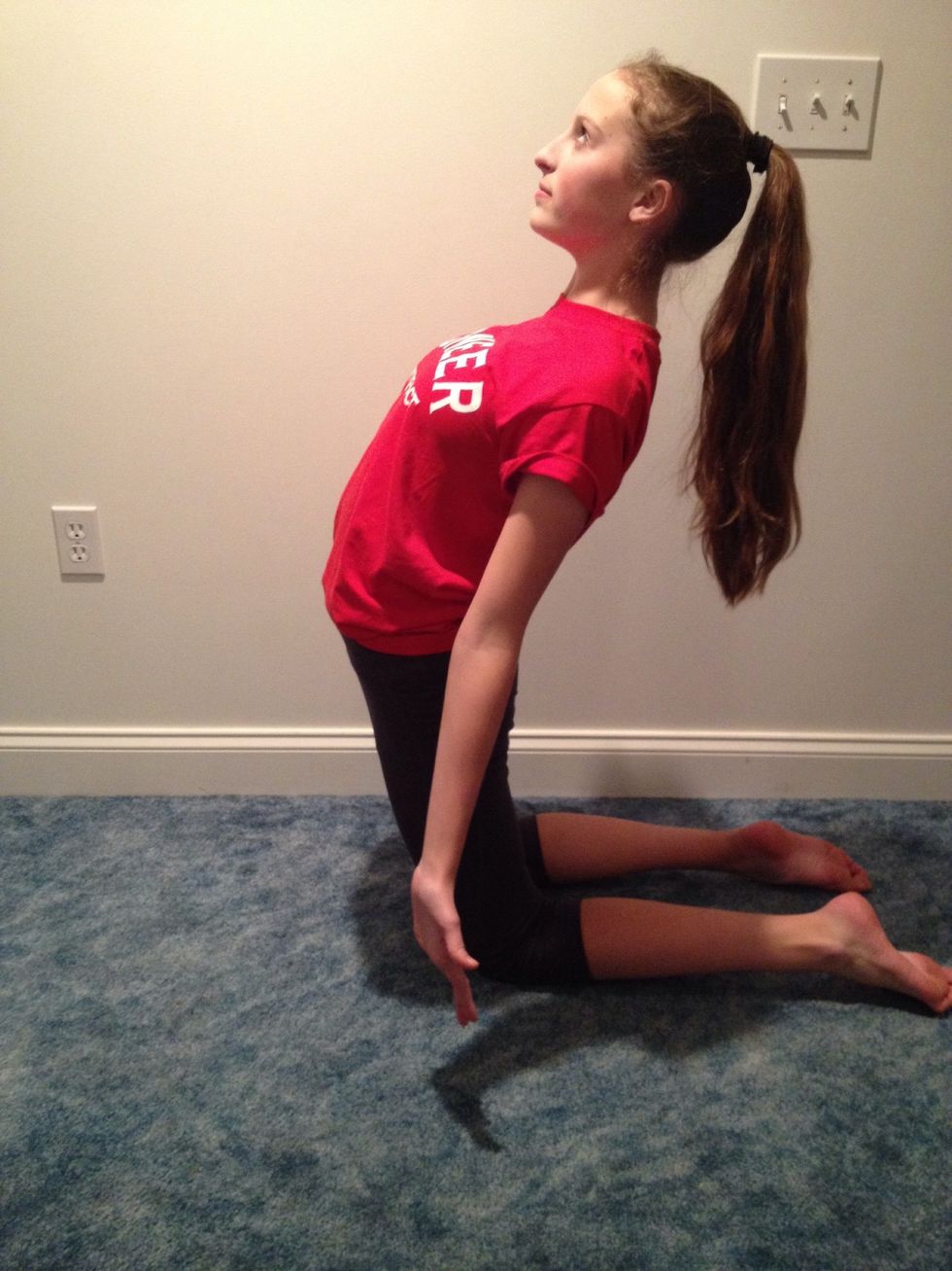 Arch back, but not too much and have your hands about next to your knees.