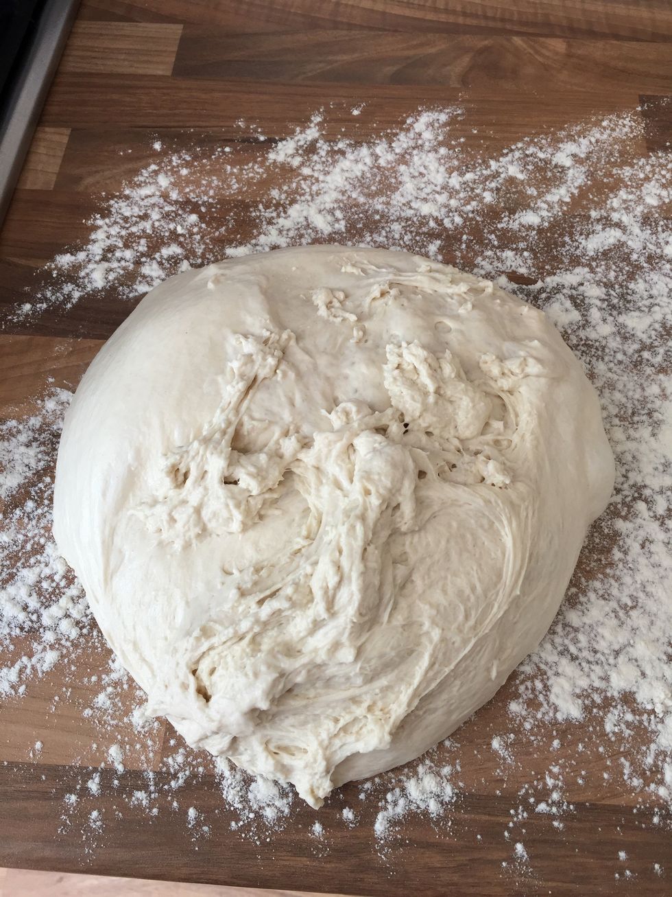 Around midday (3 or 4 hours after it was knocked back earlier in the morning), tip the dough into the floured surface.