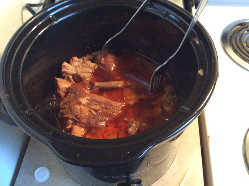 Around the last hour of cooking you should start shredding. Take two forks and start pulling apart your delicious pork til it looks like....