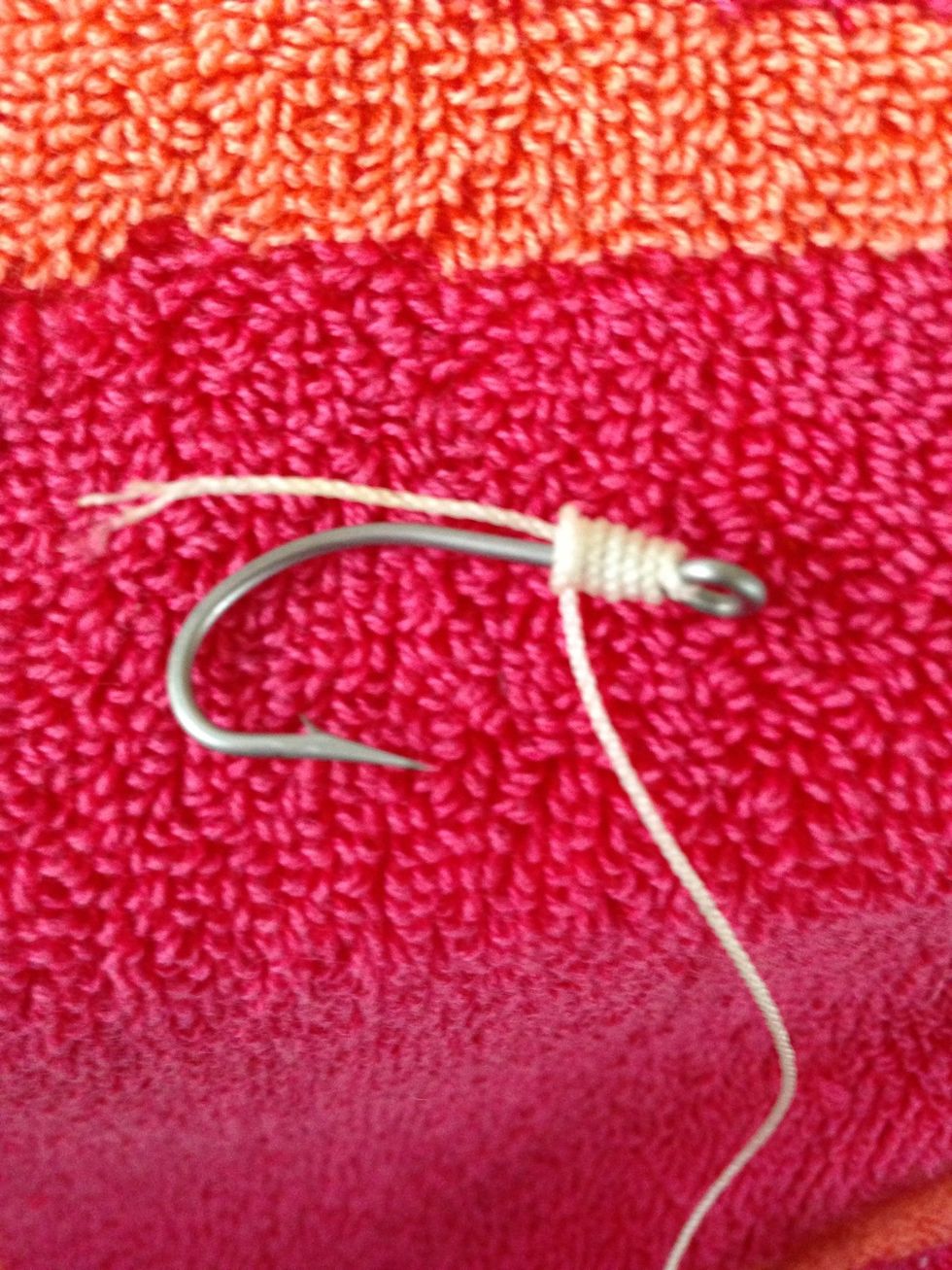 Around the poked through line, wrap the line around nine times.