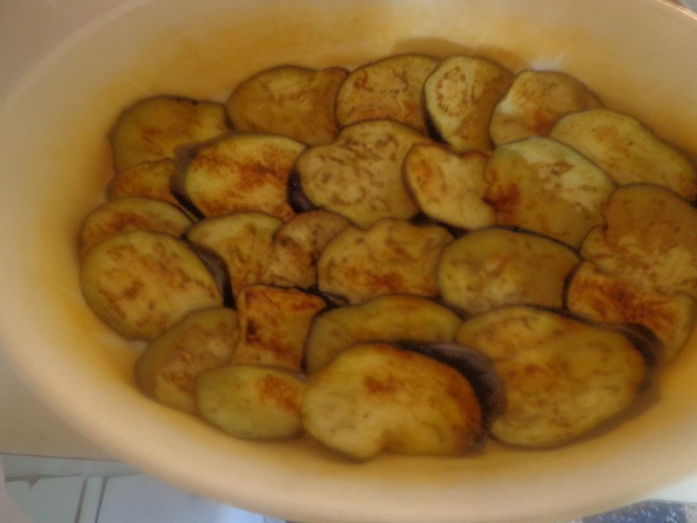 Arrange a layer of eggplant in an ovenproof dish similar to the way you lay lasagna pasta