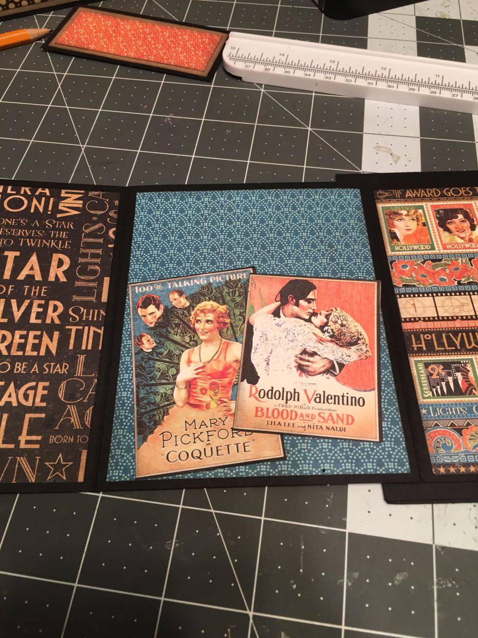 Arrange and attach down to the bottom of a page as shown. Since these are only glued on the bottom edge, you can still slid a photo or photo mat behind the place card holders.