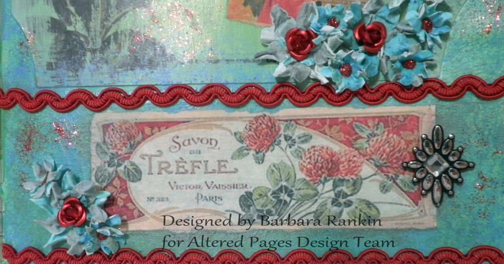 Arrange flowers on page and add Fire Red Glitter to the centers. I also added some tiny red metal roses from my stash to the centers of the big flowers, as well as red trim.
