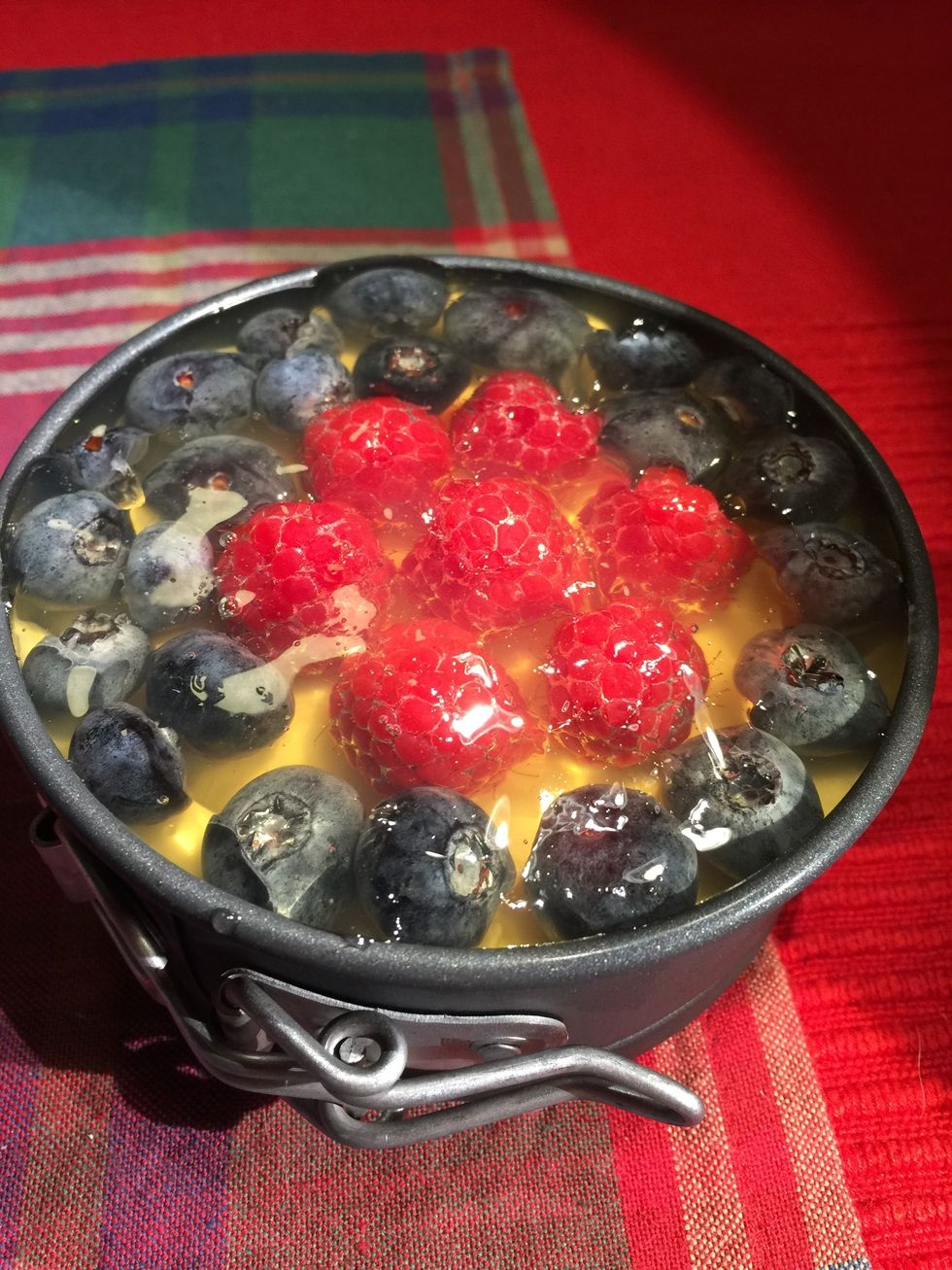 Arrange fruit on top of already set cheese layer.