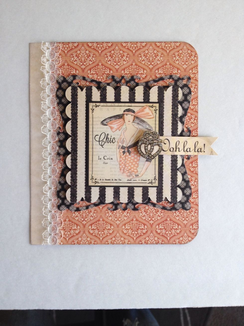 Arrange pieces per photo, then adhere. For added dimension, attach the black and white paper and fussy cut heart jewelry with foam dots.