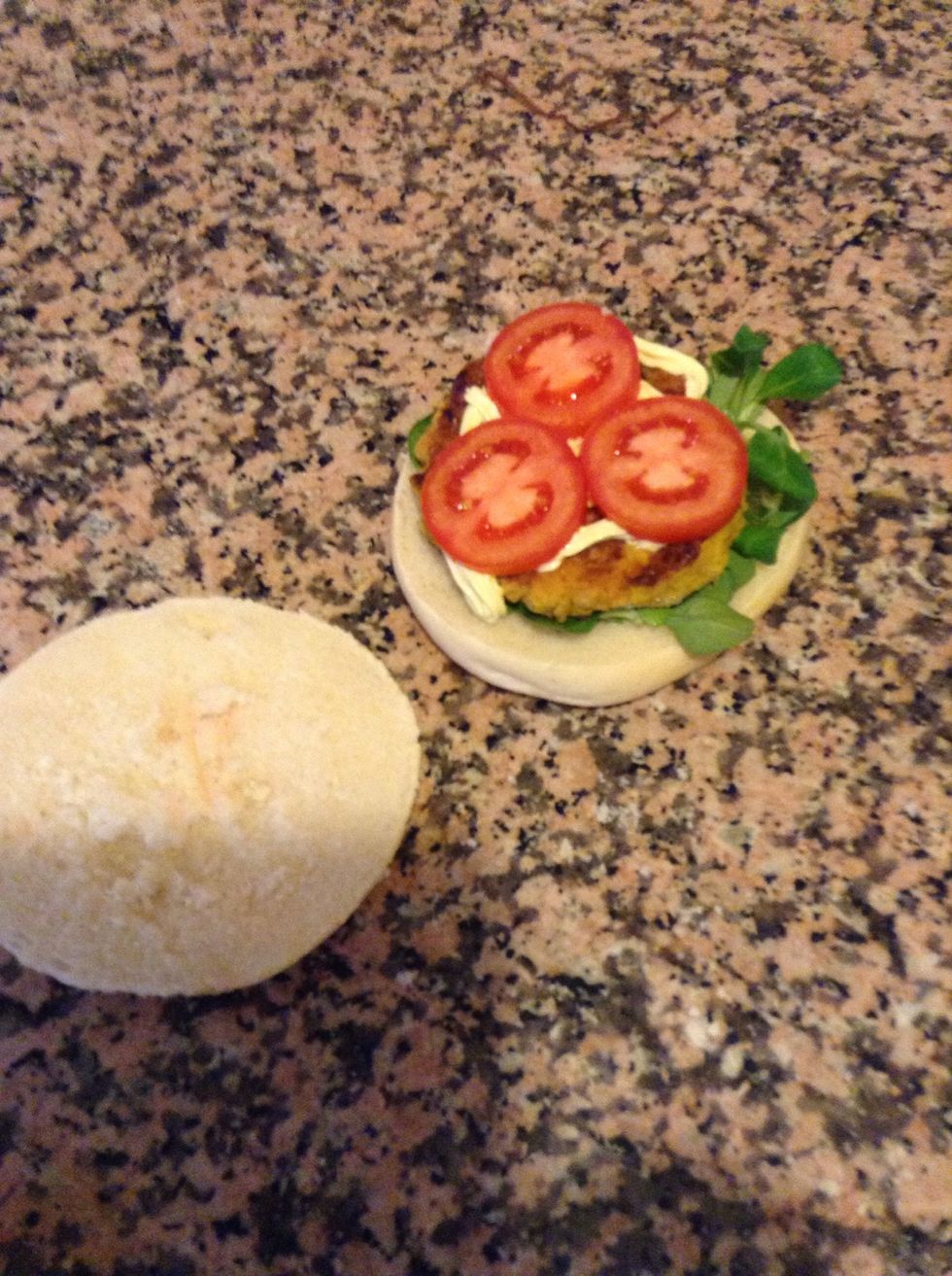 Arrange the burger on the bun together with your salad and tomatoes. Add mayonnaise if you like it.