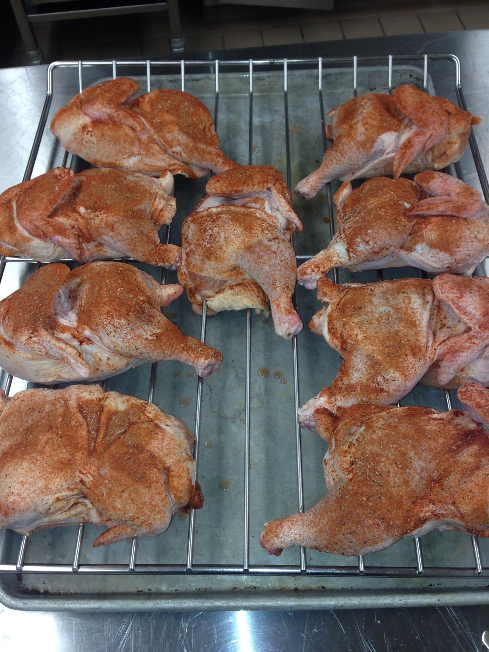 Arrange the chicken halves onto the sprayed racks. Each rack will hold 9 half chickens arranged like this.