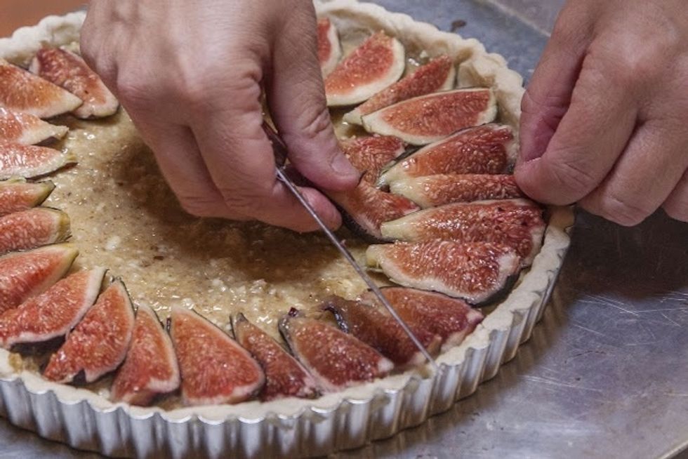 Arrange them in a circle, pointy ends of the figs heading toward the center.