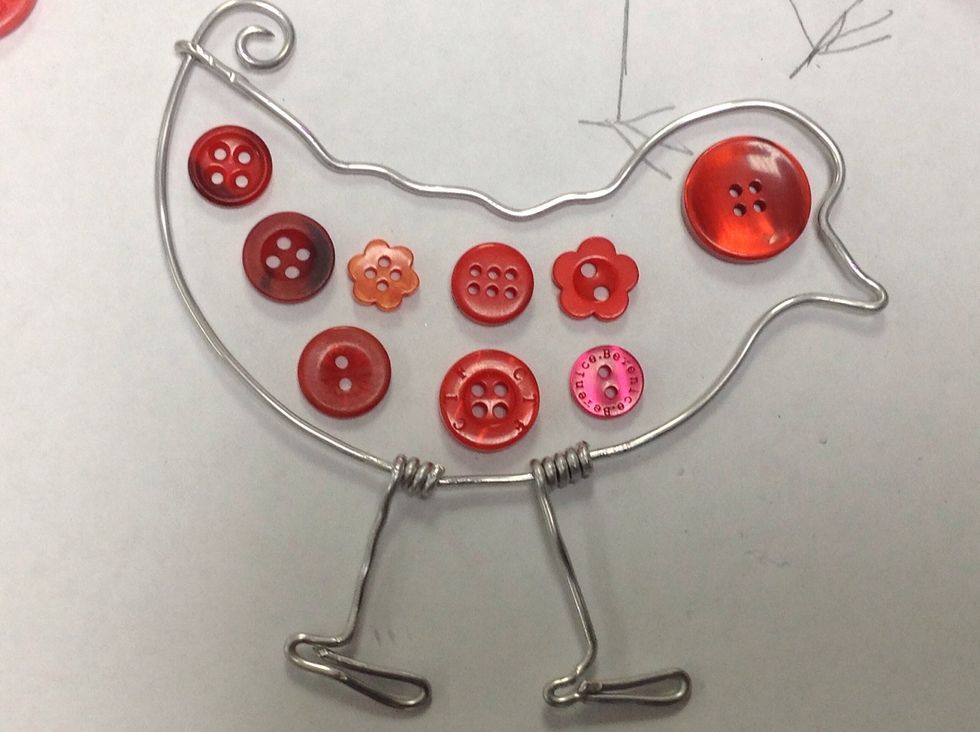 Arrange them to fill the bird shape loosely.