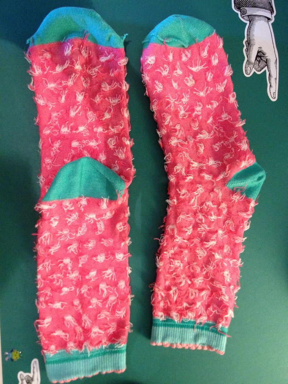 Arrange your socks like so, the flat sock will form the monkeys body and legs.