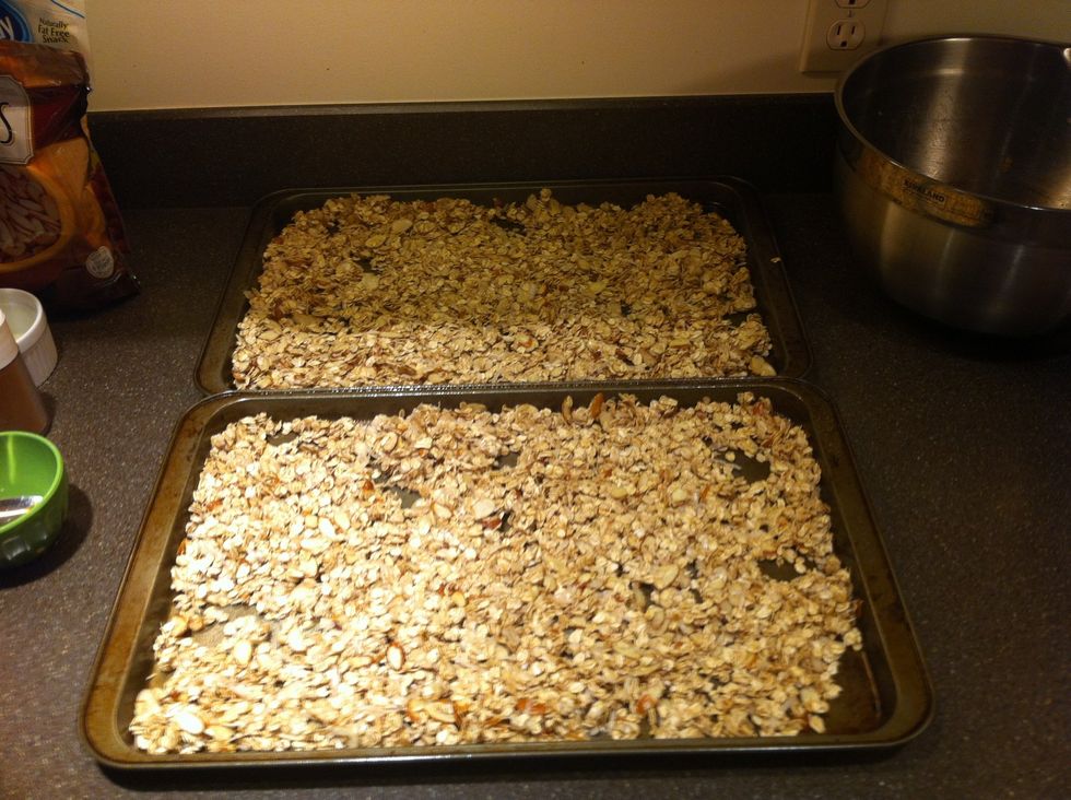 Arrange your uncooked granola on two baking sheets and bake at 325 degrees for at least 45 minutes (depending on your oven) stirring every 10 minutes or so.