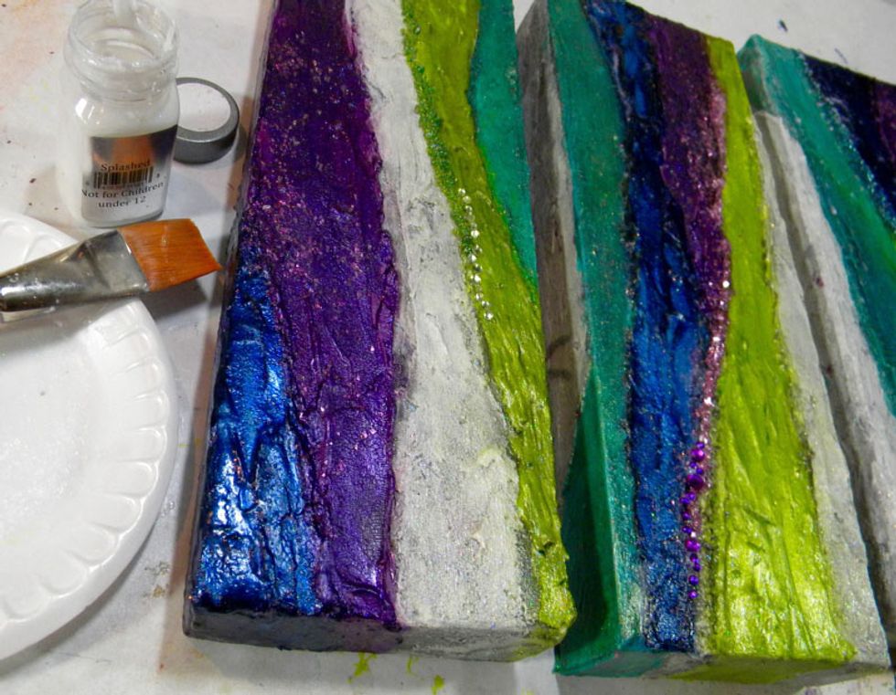 Art Anthology has several clear coat paints with glitter that add shimmer and also protects. To seal everything in place,  paint a coat of Splashed Sorbet onto the canvases.