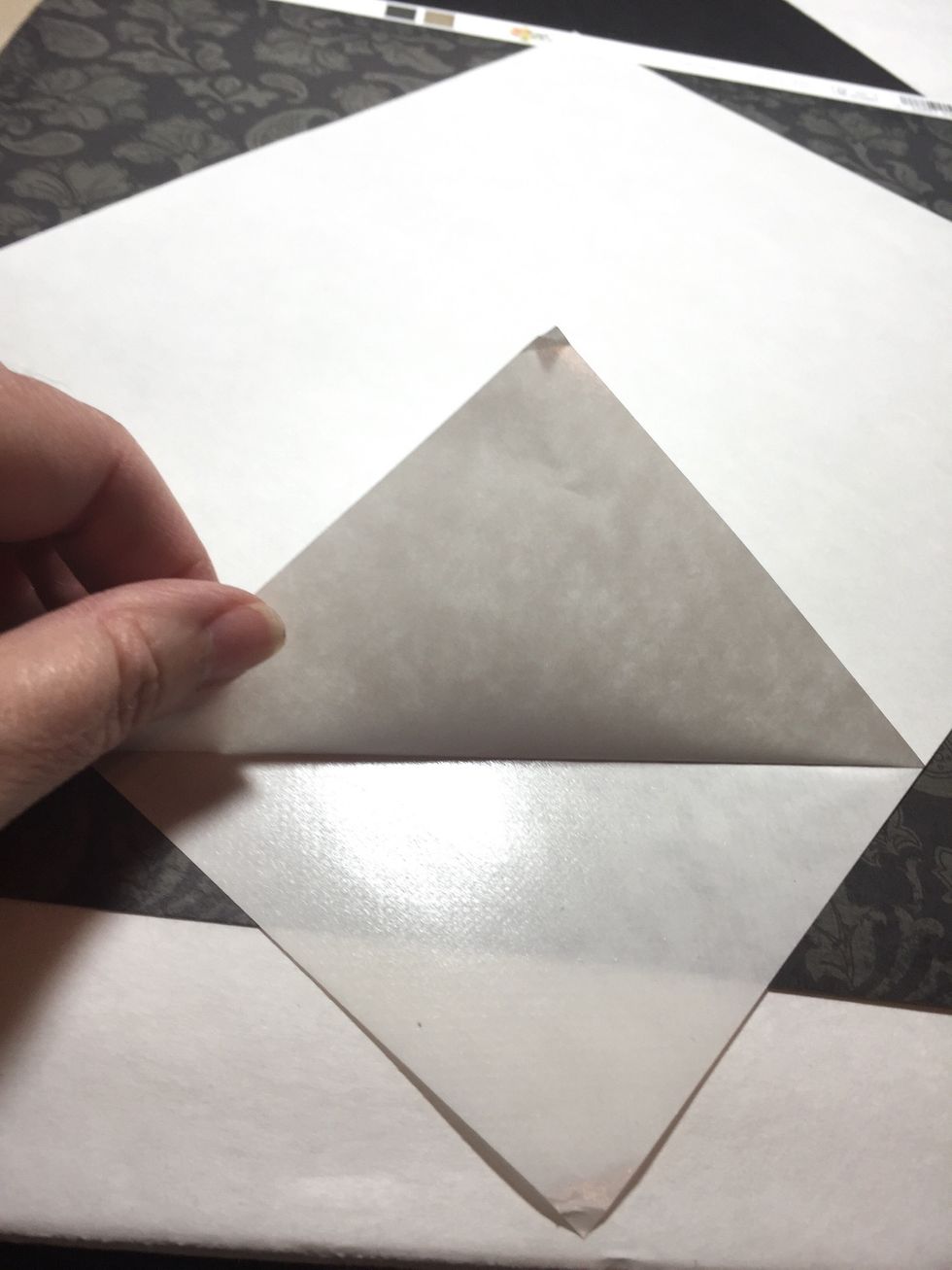 Artist-Tac is a dry adhesive that is easy to use and provides a very strong, secure bond. start by removing a corner of the backing.