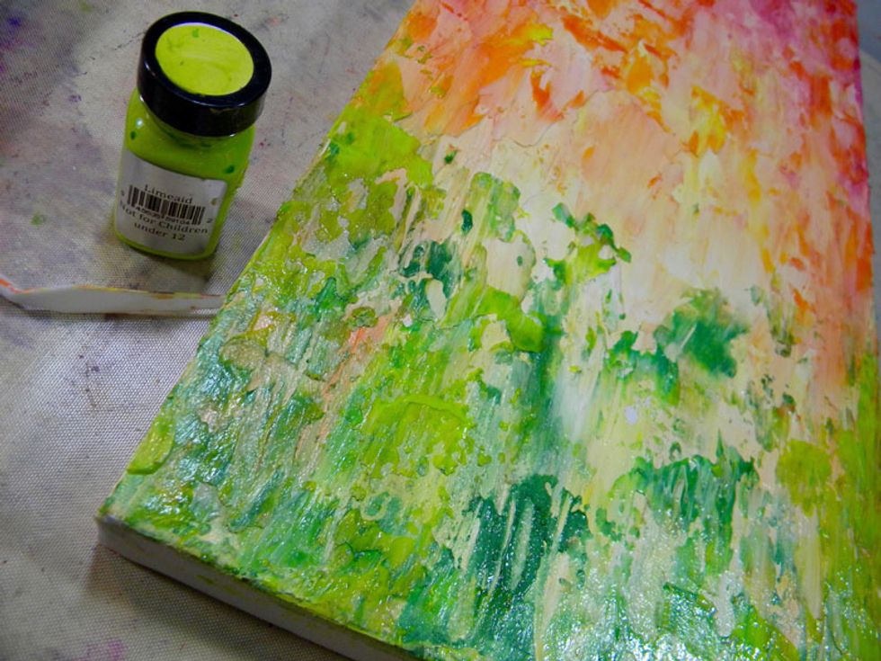As a final touch, add a bit of Limeade to the greens on the bottom of the canvas.  Since the layers underneath are mixed with gesso, adding touches of straight color makes these areas really pop.