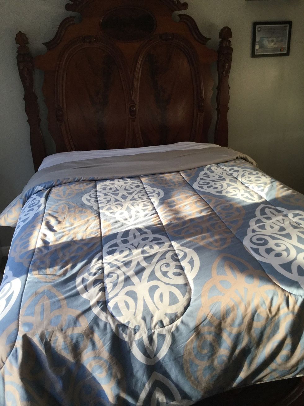 As an option you can pull the comforter down slightly at the head of the bed to make it easier to climb into the next time you go to sleep