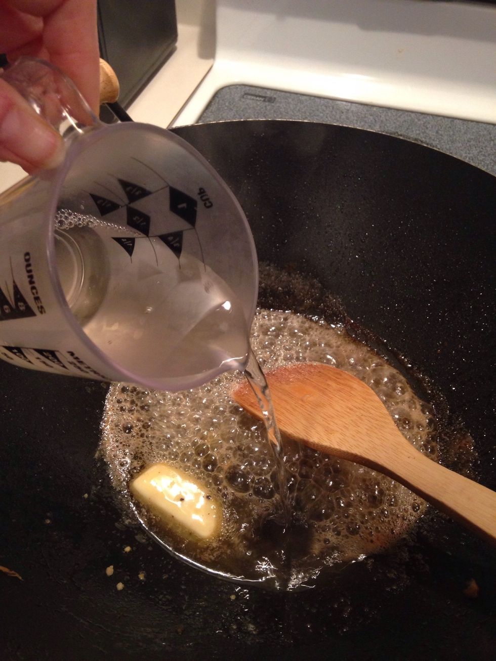 As garlic starts to brown, add wine (or chicken stock.)