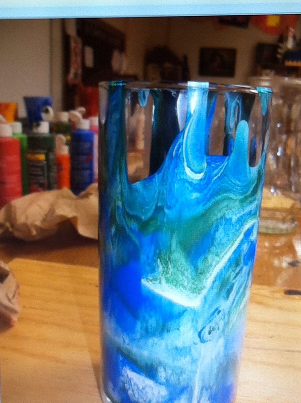 As gravity pulls the paints, the colors will mix!