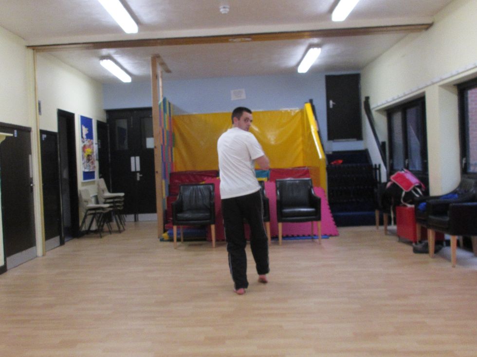 As I turn, I shift the bodyweight away from the foot that is turning or moving, onto the opposite foot. Here, because I am drawing the rear foot in, my weight is on the front foot which has pivoted.