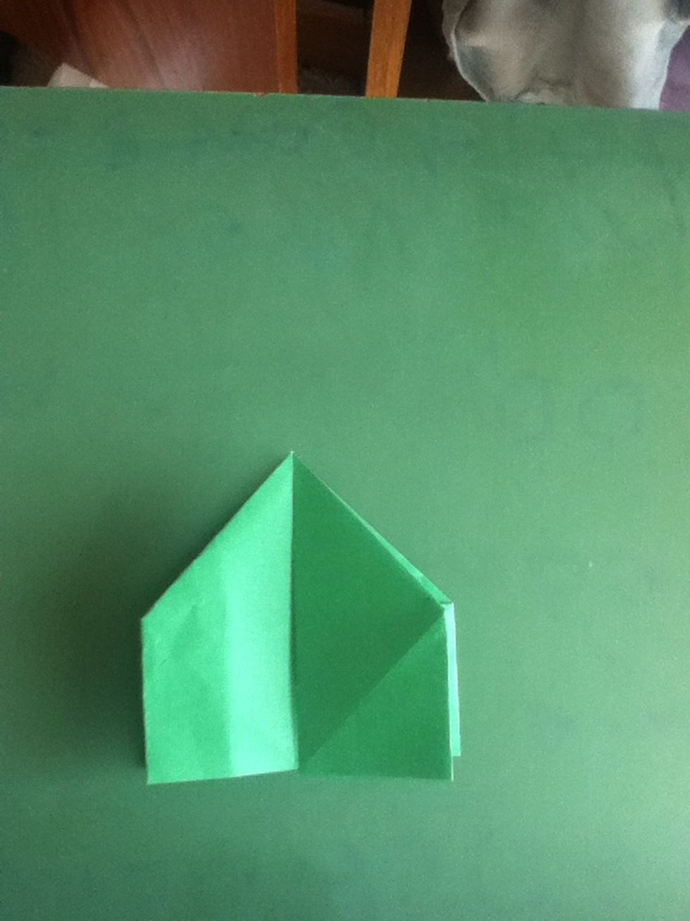 As if turning a page in a book, fold the large flap on the right to the left; repeat on reverse side