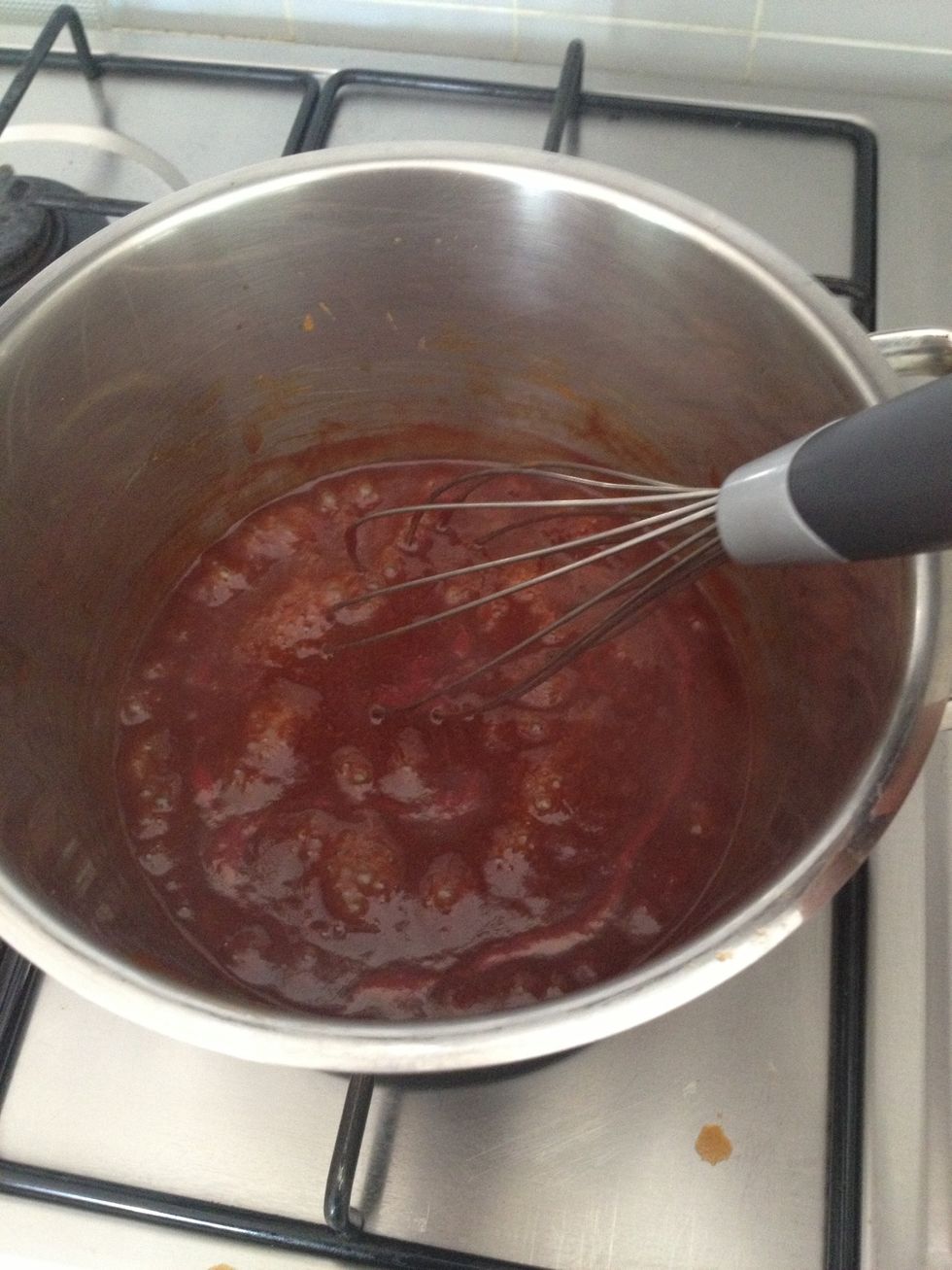 As it boils it will start to separate, give it a stir occasionally. Once it boils, turn the heat down and let it simmer until sauce thickens.